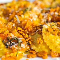 close-up of raviolis topped with bread crumbs